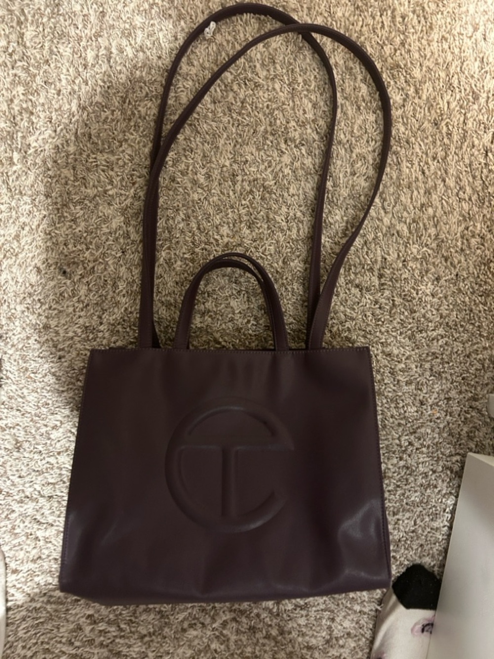TELFAR Embossed Circle Tote Bag in Deep Plum 100.00